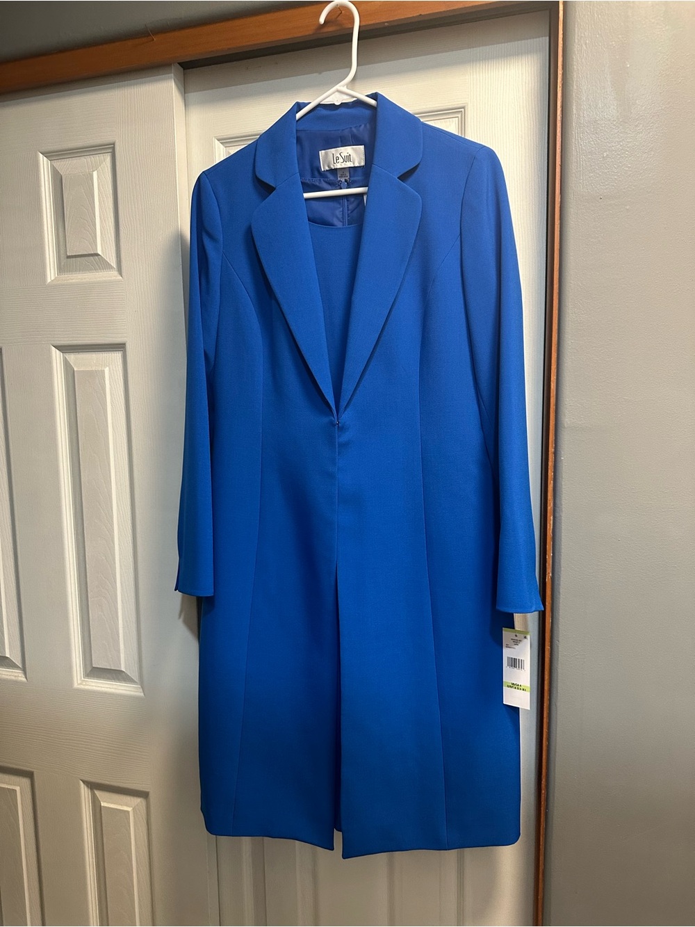 Cobalt Blue Luxury Dress with Sleek Trench Coat with tailored lapel.